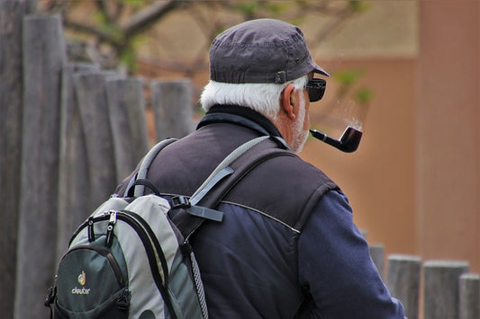 Older Man Smoking a Pipe, Needing to Poop